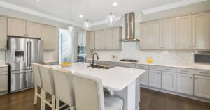 Large kitchen with white cabinets